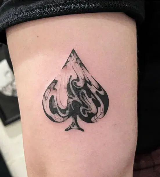 The Queen of Spades tattoo represents femininity, intuition, and mystery.